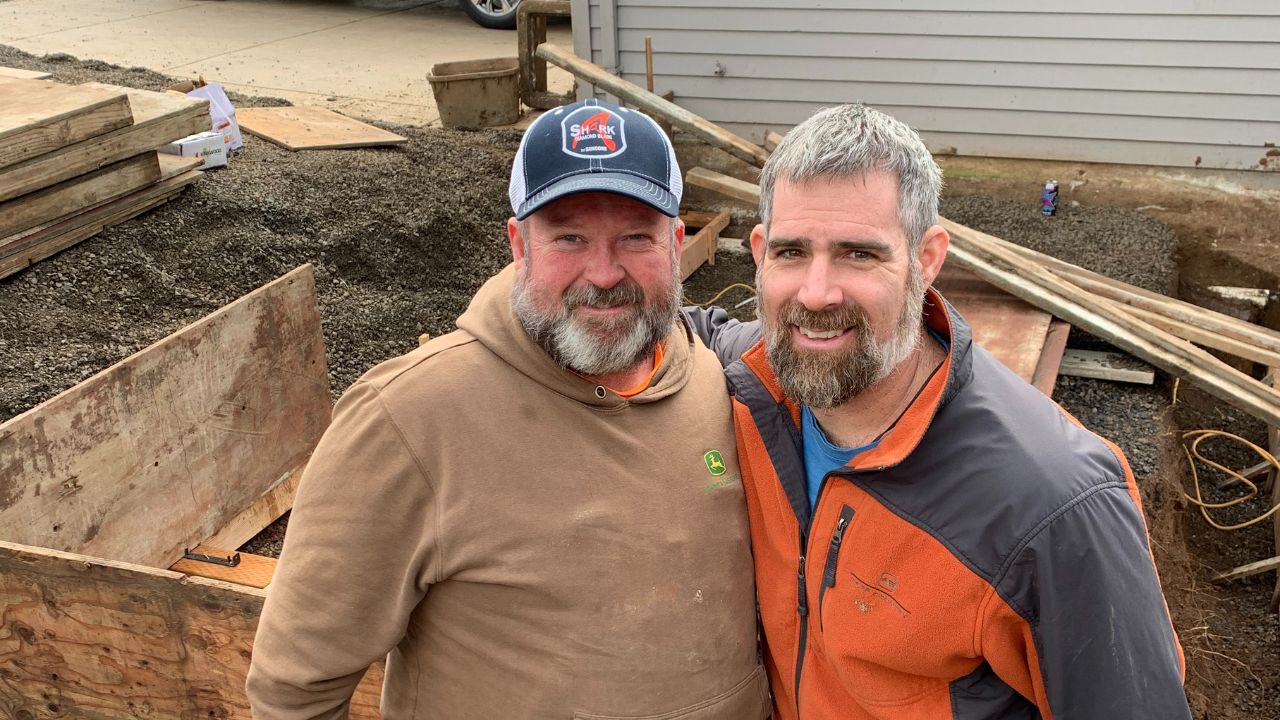 Two All Building Construction builders at a job site