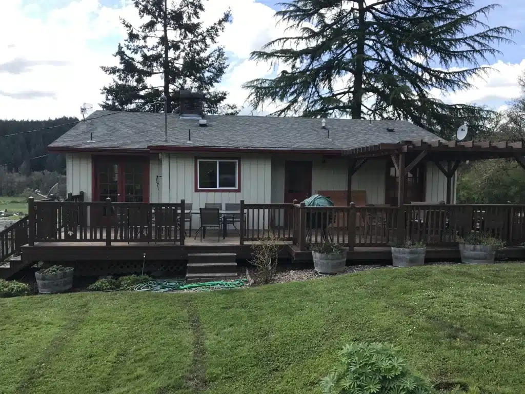Wood deck and pergola cover designed for Oregon’s rainy climate at a Newberg home.