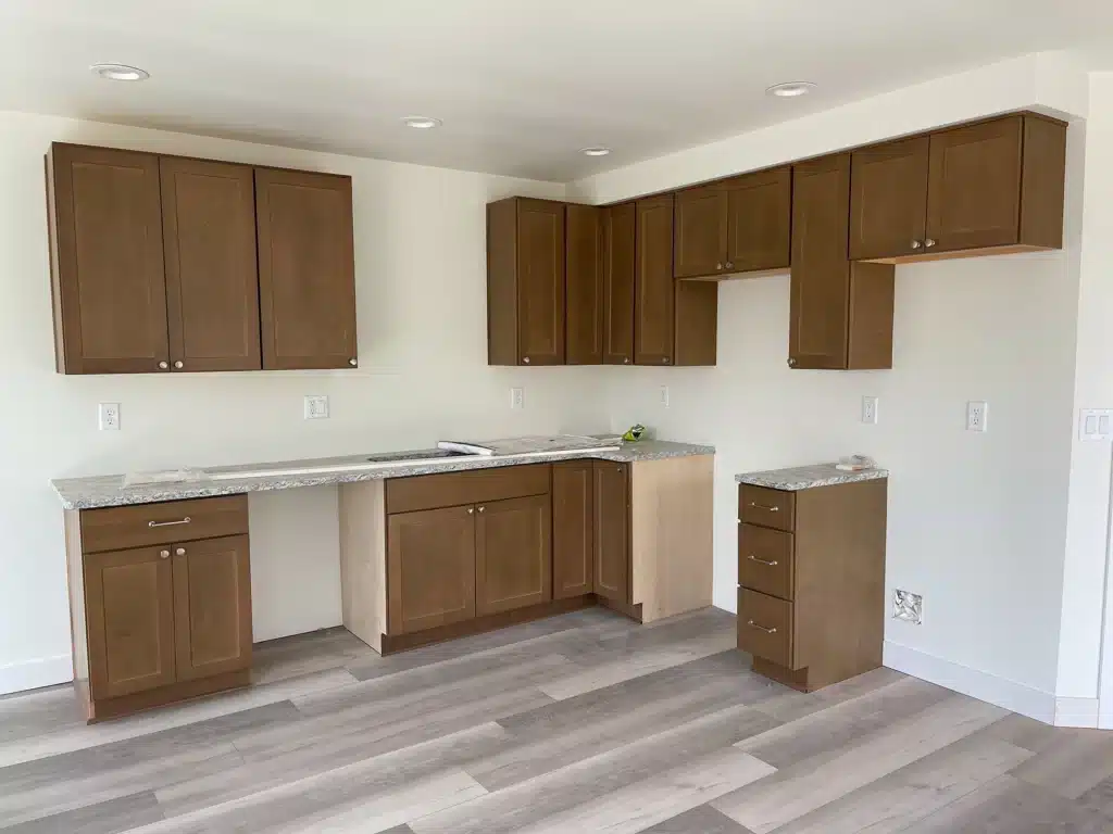 Kitchen cabinets and countertops installed in new duplex