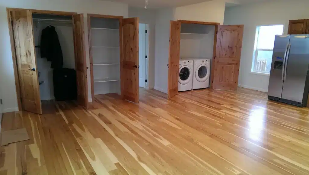 Open closets and laundry area with hardwood flooring in Hillsboro, Oregon