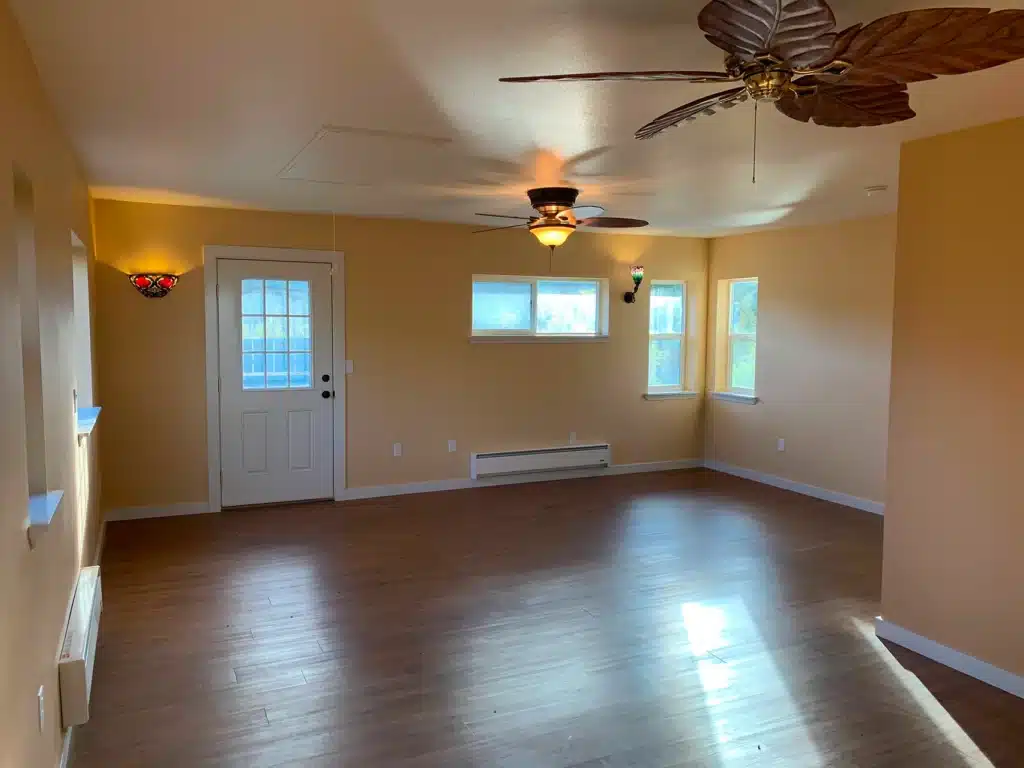Open living room with new flooring in McMinnville home