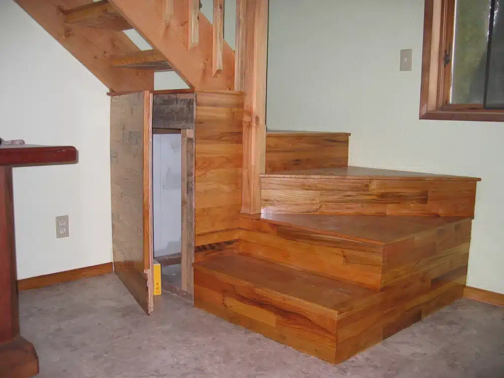 Hardwood staircase with open storage access panel