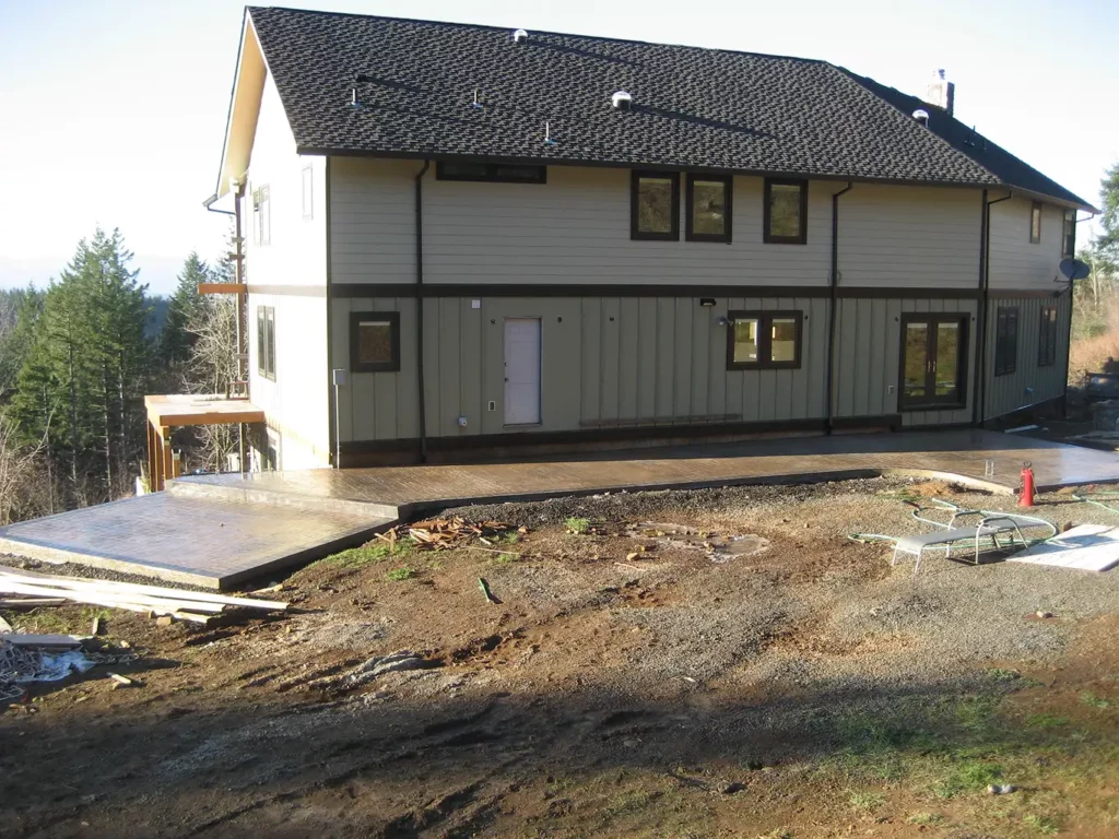 Wide view of home with new stamped concrete patio installation