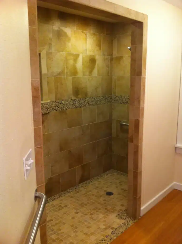 Interior renovation showing subflooring and exposed wall framing