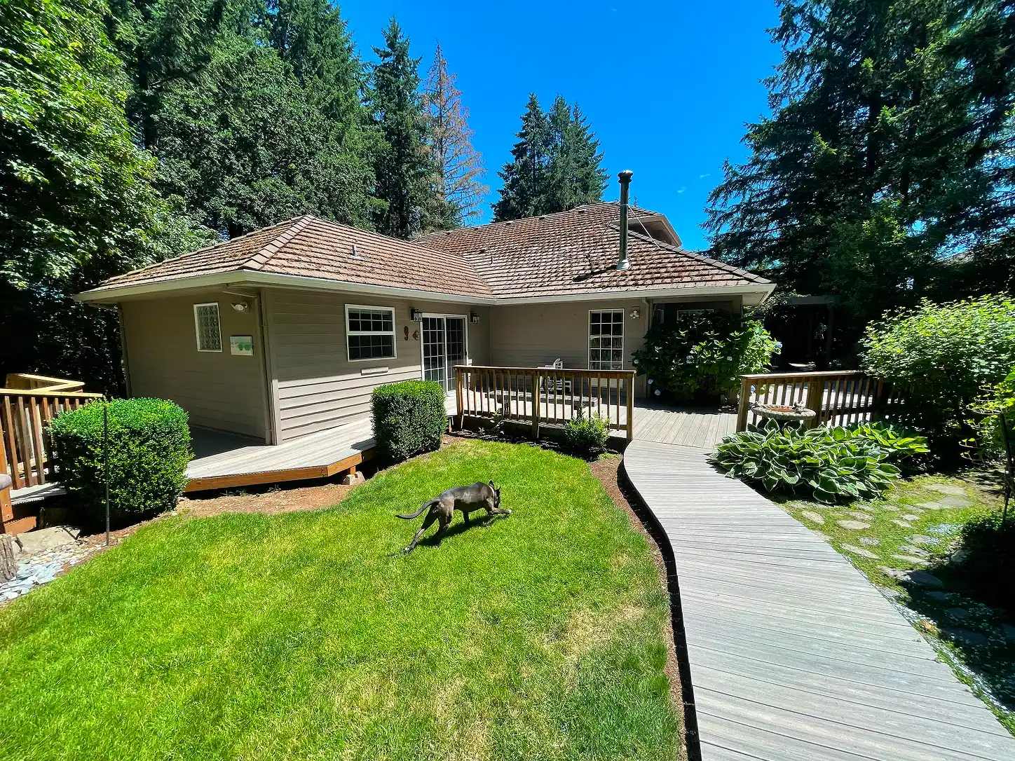 Backyard composite walkway and deck at Sherwood home