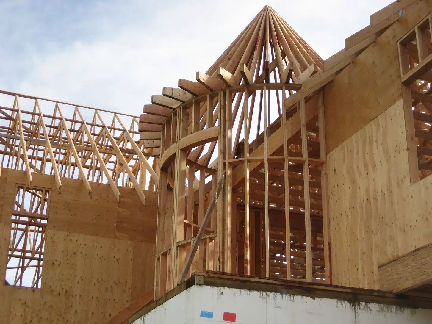 Detailed view of turret framing and rounded roof structure during custom home build in Newberg, Oregon