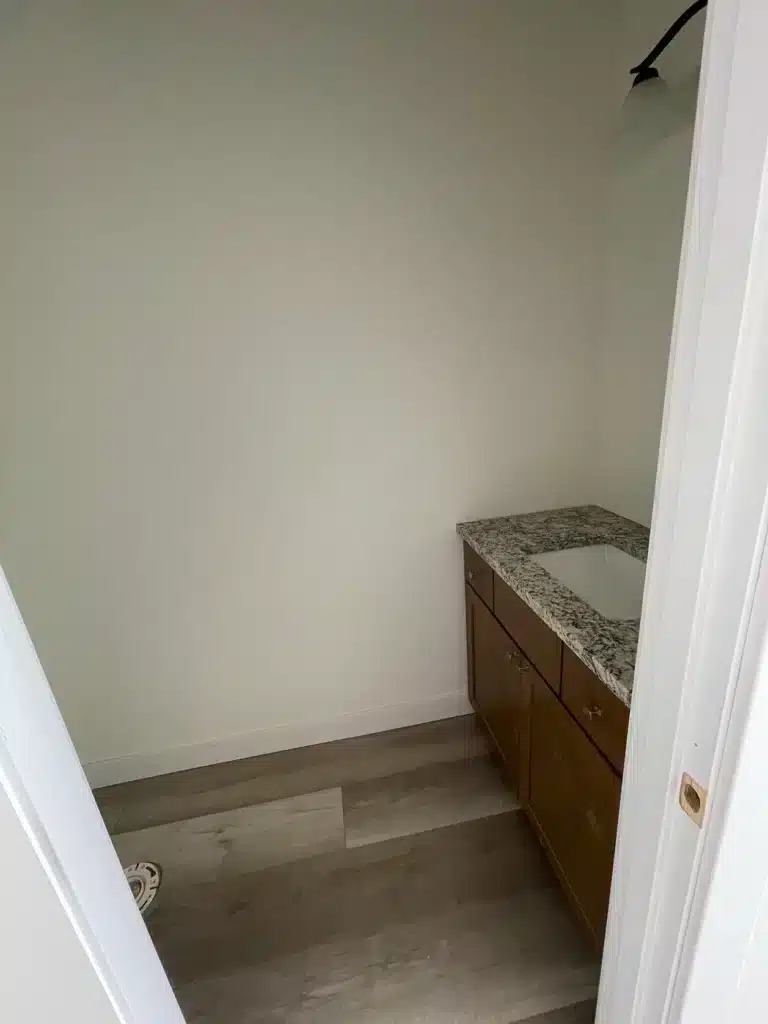 Compact bathroom with new vanity and flooring