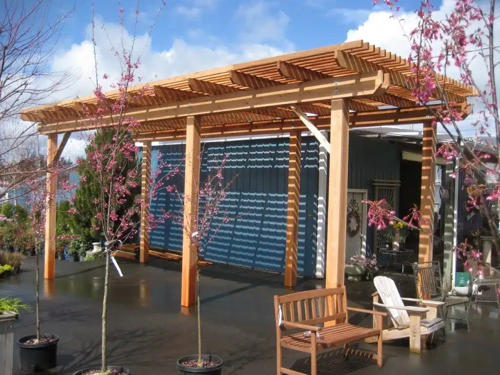 Open cedar pergola built to handle Oregon’s wet weather for outdoor seating areas.