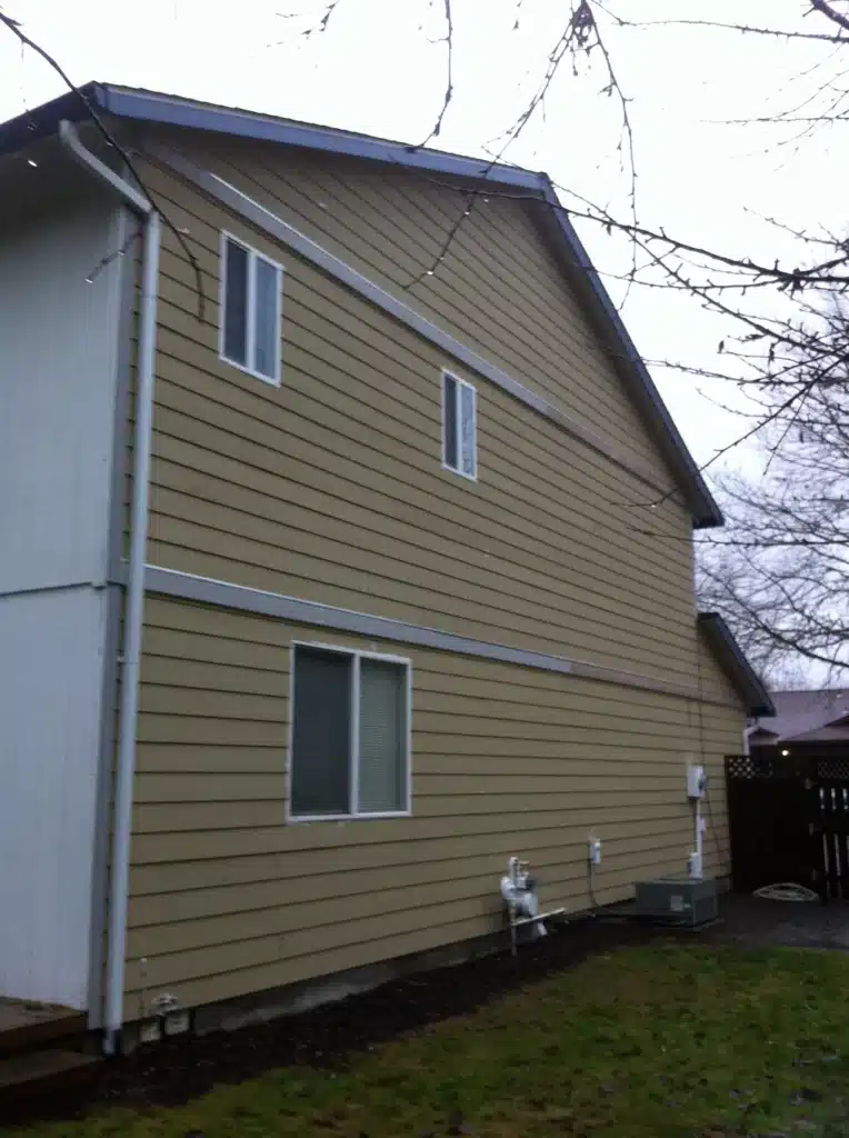 Exterior trim boards being cut and prepared for installation
