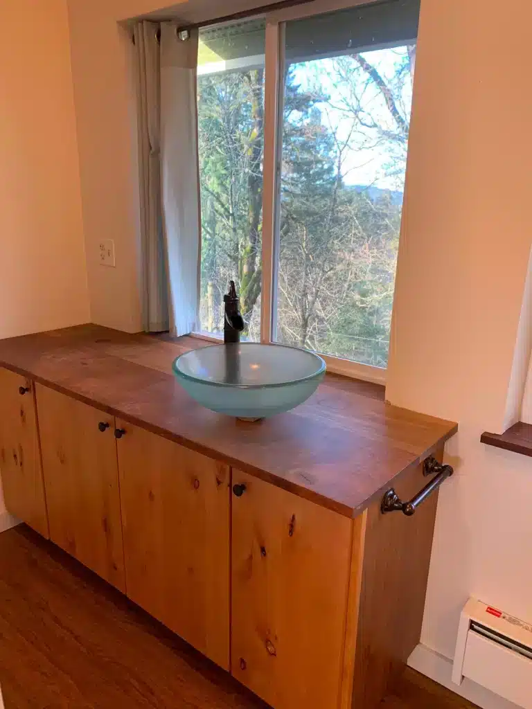 Wood vanity with vessel sink in McMinnville remodel