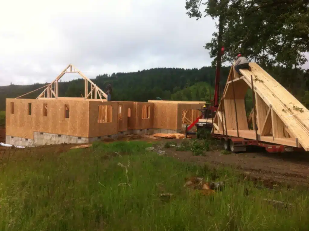 Roof trusses being installed on a custom home build in rural Hillsboro, Oregon