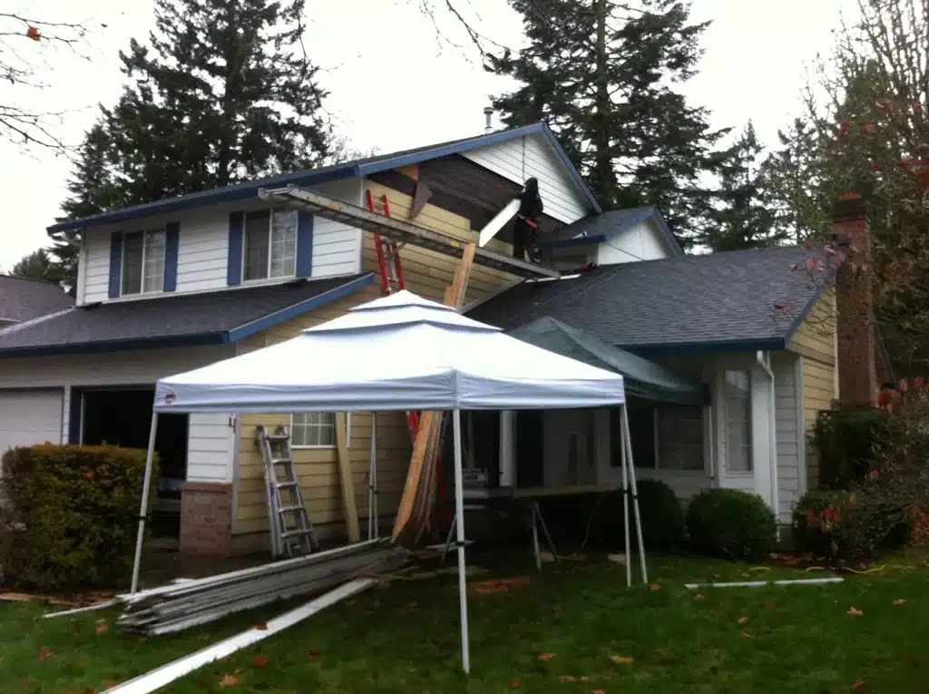 Old siding and trim pieces removed during repair process