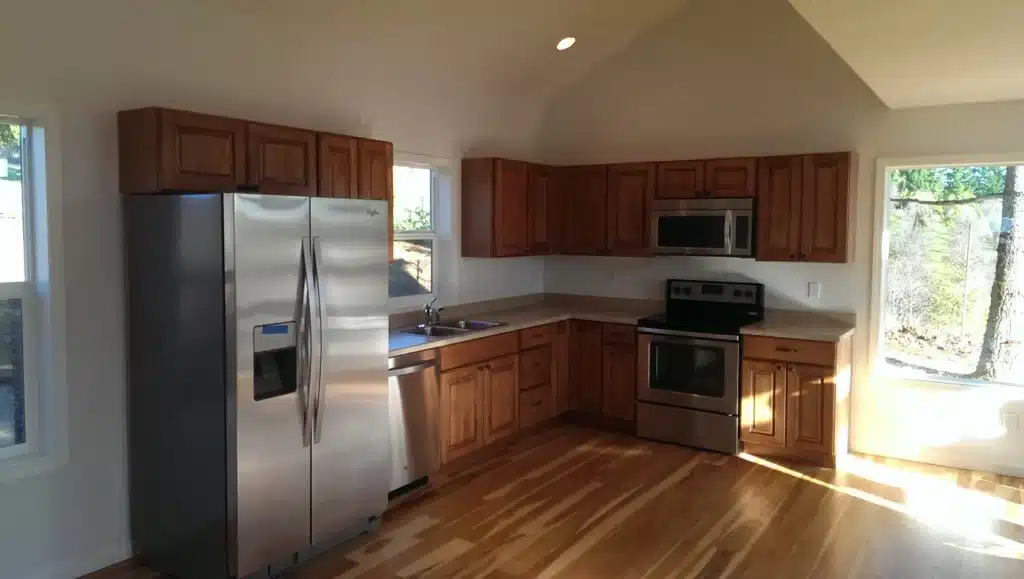 Kitchen remodel with stainless appliances and hardwood floors in Hillsboro, Oregon