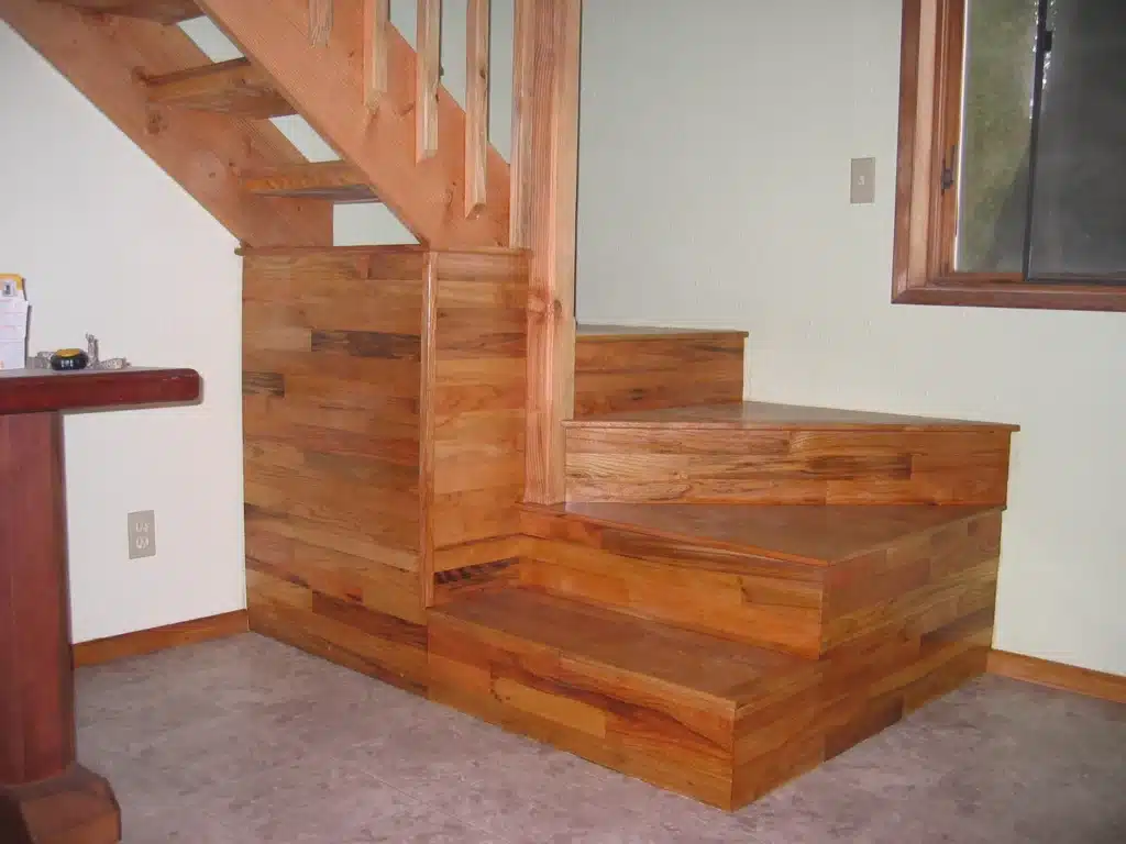 Custom wood staircase with finished treads and side paneling