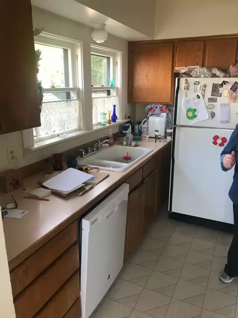 Older Sherwood kitchen before remodel with wood cabinets and laminate counters