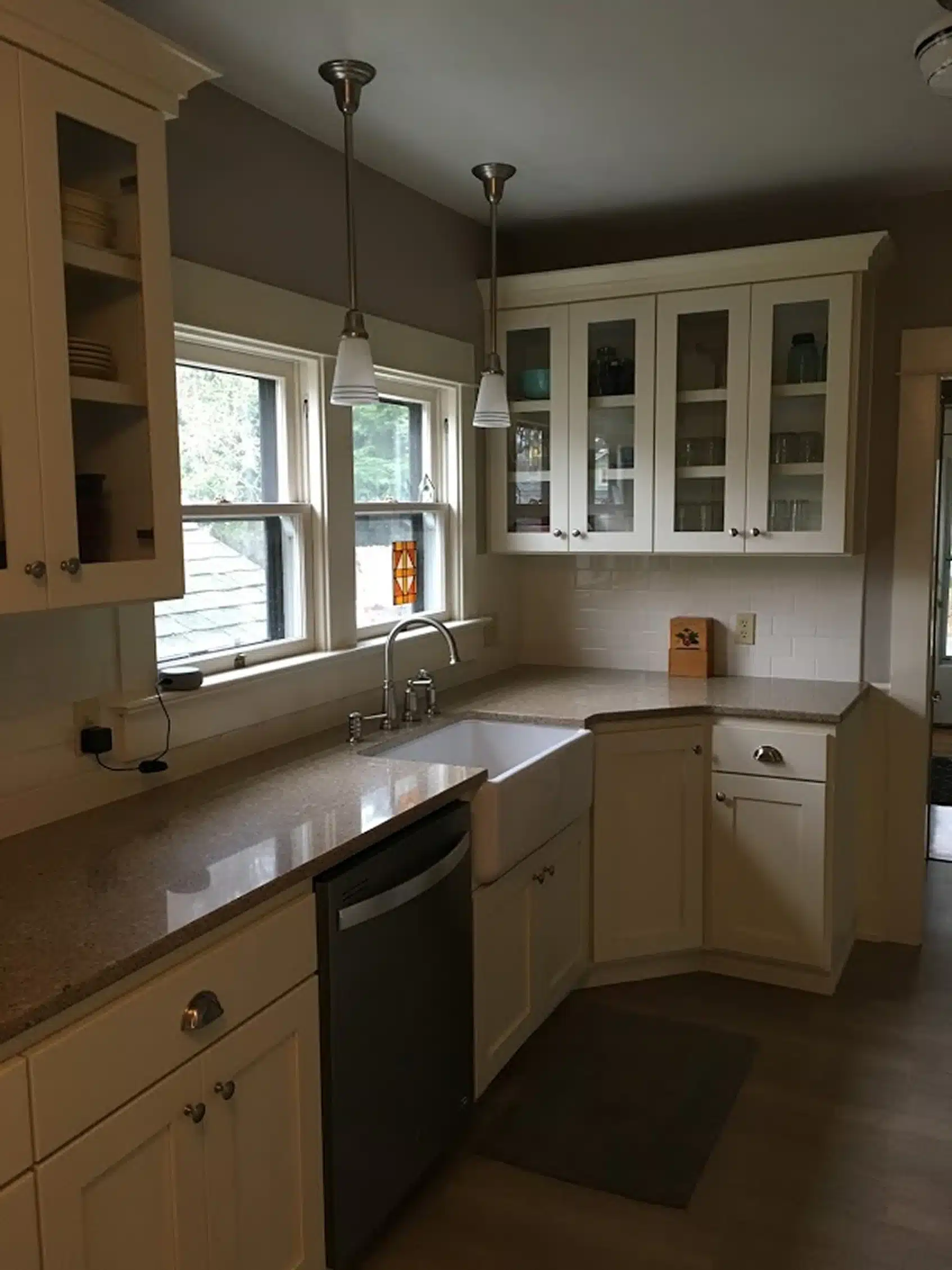 Modern Sherwood kitchen with white cabinets, farmhouse sink, and quartz counters
