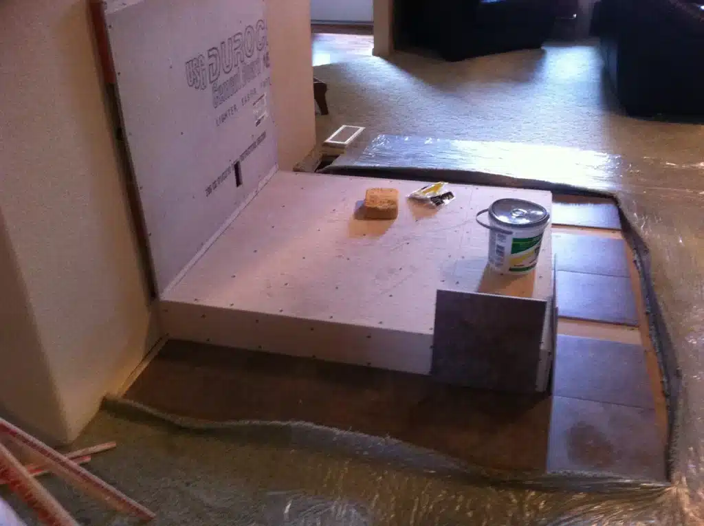 Framed hearth platform under construction for wood stove installation